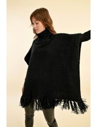 Turtleneck poncho with pompoms