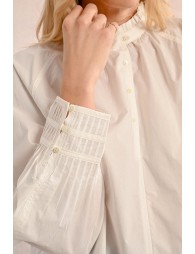 White pleated blouse